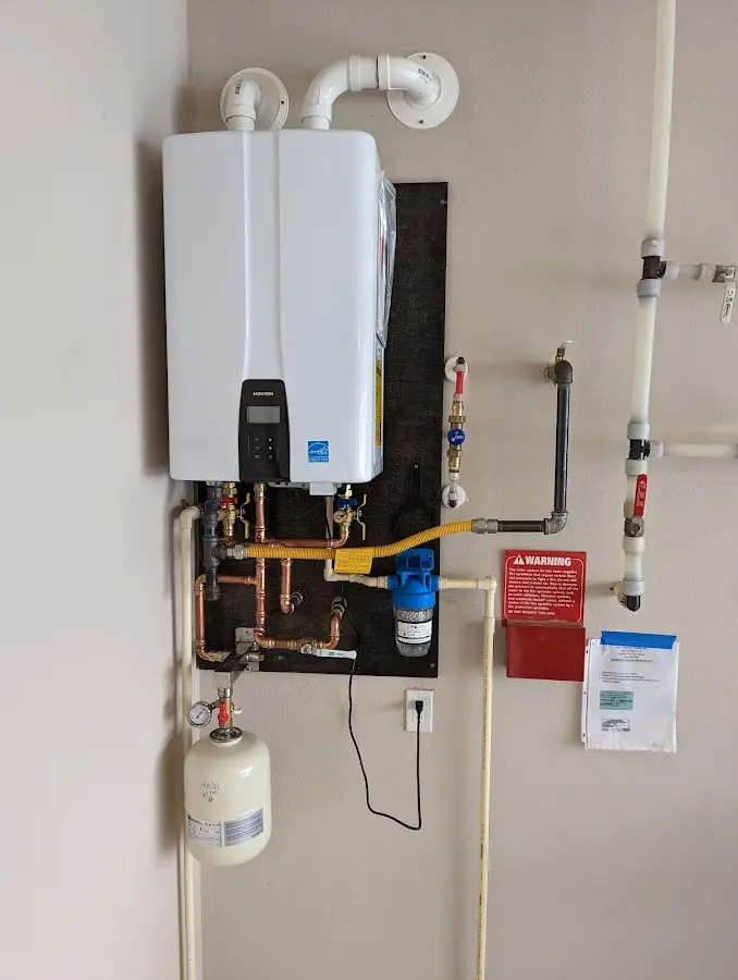 Professional plumber installing copper piping in a Villa Ridge home